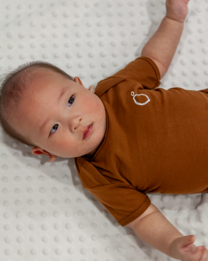 LIMAU short sleeve bodysuit is made from breathable cotton fabric, making it suitable for warm weather and casual wear.