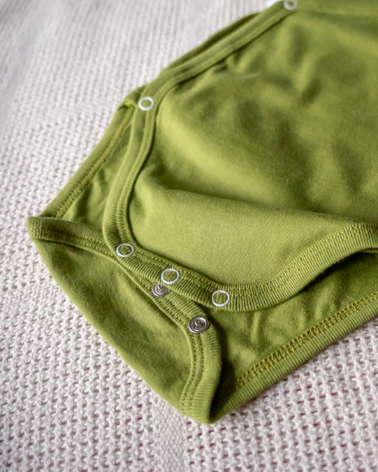 LIMAU kimono bodysuit features press-studs at the crotch for easy nappy changes.